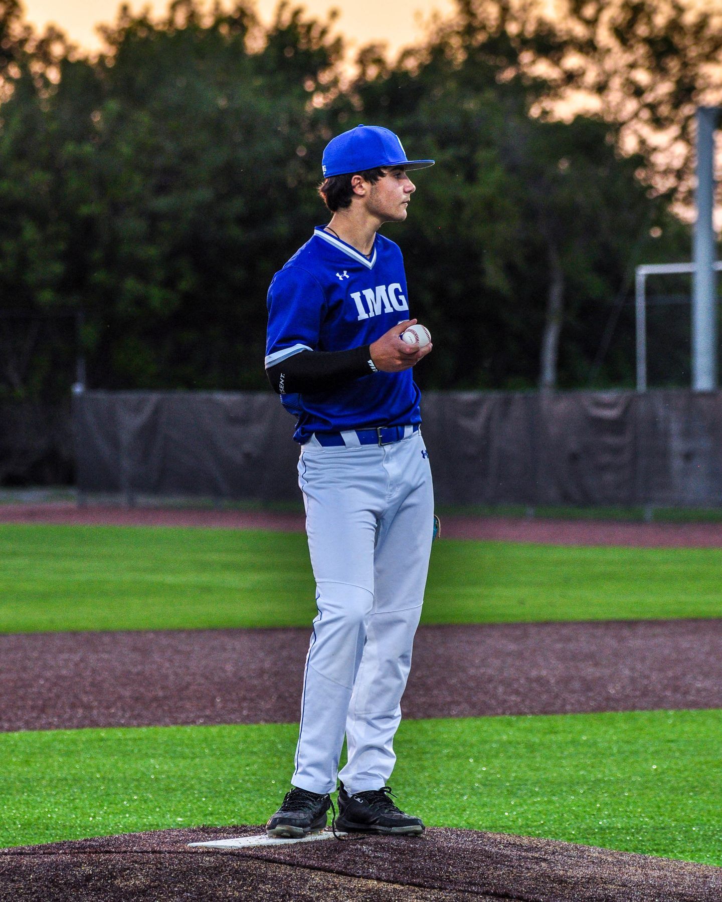 Pitcher set on the rubber at dusk